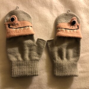 Children’s unisex convertible soft knit light gray and pink dinosaur mittens/half finger gloves.