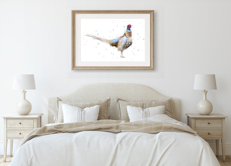 May include: A watercolor painting of a pheasant with brown, white, and blue feathers. The pheasant is standing on a white background with a few blue dots.