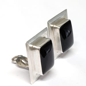 May include: A rustic wooden sign with the text "Welcome to our home" in white lettering. The sign features a distressed finish and a simple, inviting design, perfect for a front porch or entryway.