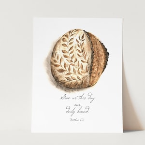 May include: A watercolor painting of a loaf of bread with a leafy design. The text "Give us this day our daily bread. Matthew 6:11" is written below the bread.
