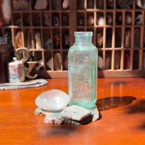 Antique Curiosity Set: Aqua Glass Bottle, Quartz Palm Stone, K2, Stone Slab