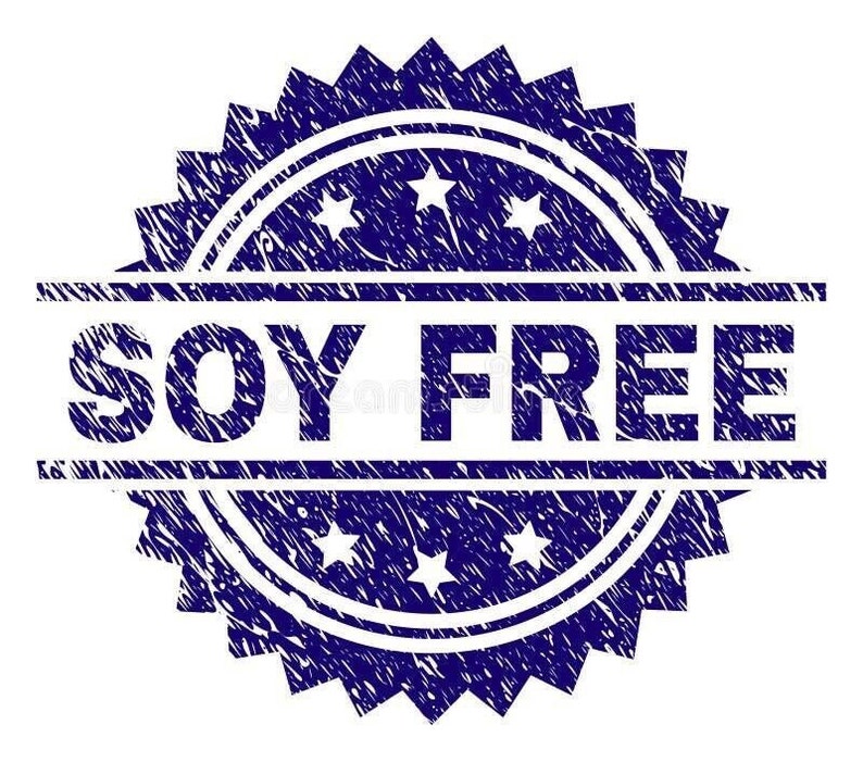 May include: A blue, textured stamp with the words "SOY FREE" in bold white letters. The stamp has a circular design with stars and a jagged edge, suitable for food packaging.