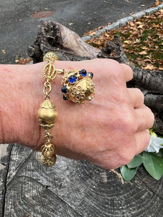Heavy gold on sale charm bracelet