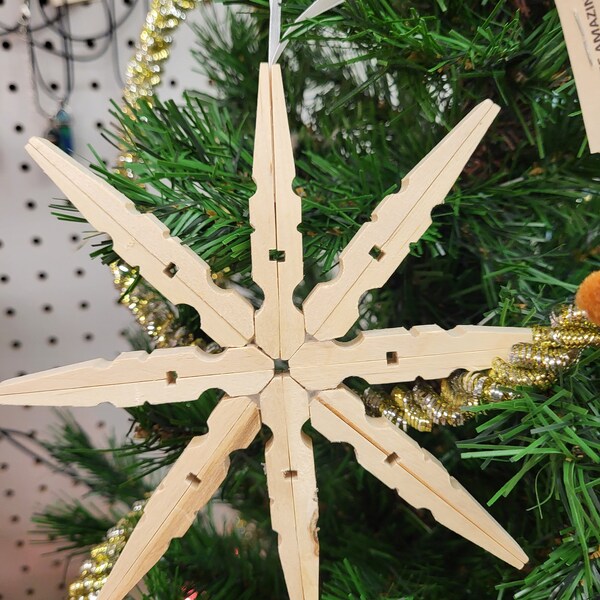 6-inch star or snowflake ornament  includes a hanging ribbon. Three finishes: natural, shabby white, and gold. Clothespin, snowflake, star