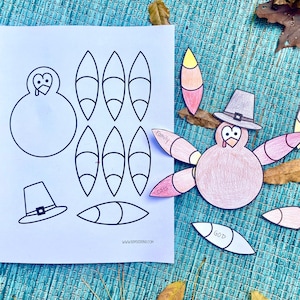 May include: A Thanksgiving-themed craft project featuring a paper turkey with colorful feathers and a pilgrim hat. The image includes a printed sheet with turkey body parts and feathers for cutting and assembling. The feathers have words like "Family" and "God".