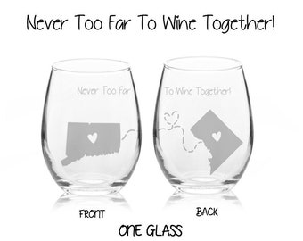 May include: Two wine glasses with etched outlines of Connecticut and Washington D.C. with hearts in the middle. The text on the glasses reads "Never Too Far To Wine Together!" and "To Wine Together!"