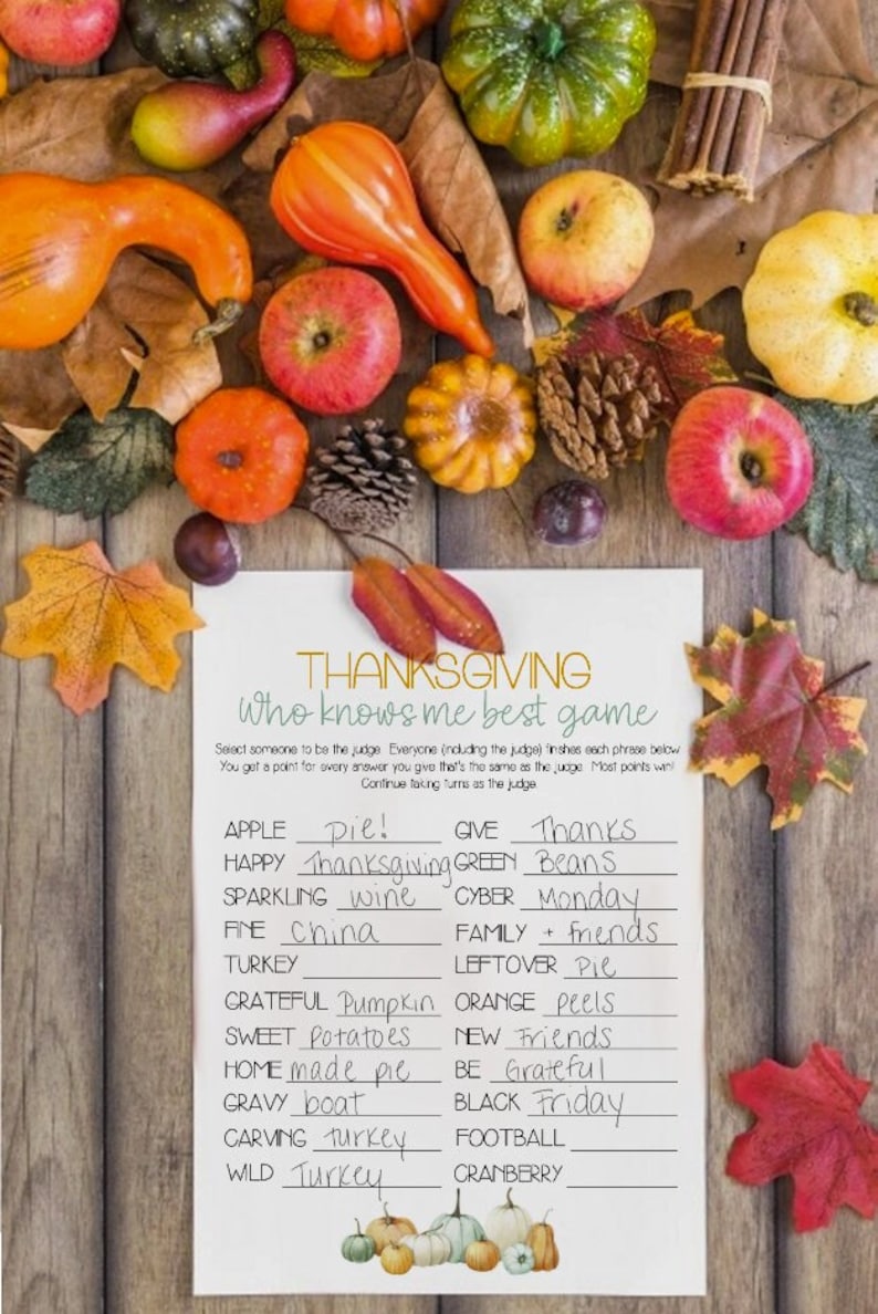 May include: Thanksgiving-themed game with colorful gourds, apples, and fall leaves. A white paper with the text "Thanksgiving Who Knows Me Best Game" is in the center, with fill-in-the-blank phrases.