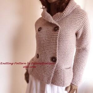 May include: A knitted double-breasted cardigan with a collar, two pockets, and brown buttons. The cardigan is a light pink color. "Knitting Pattern by Pillandpattern etsy.com" is written in red text at the bottom of the image.