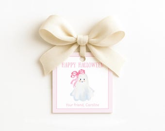 May include: A square white gift tag with a pink dotted border, topped with a cream-colored ribbon bow. The tag features the text "HAPPY HALLOWEEN" in pink, a watercolor illustration of a white ghost with a pink bow, and "Your friend, Caroline" below.