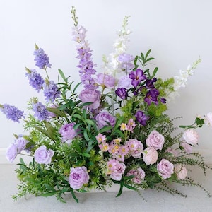 Shades of Purple Wedding Aisle Flowers Sweetheart Table floral Lilac Spring Flowers Centerpieces Ceremony Ground Arch Arrangements Flower