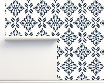 May include: A white wallpaper with a repeating pattern of dark blue geometric shapes. The pattern is a stylized floral design with a diamond shape in the center.