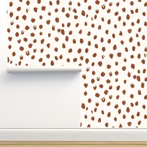 May include: White wallpaper with a repeating pattern of brown, hand-painted dots.