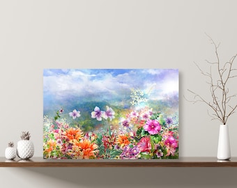 May include: A watercolor painting of a field of flowers in shades of pink, purple, orange, and yellow. The flowers are arranged in a cluster in the foreground, with a blue sky and white clouds in the background.