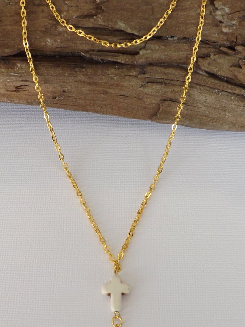 Ladies gold plated 2 strand Y style necklace with carved stone cross and gold plated heart