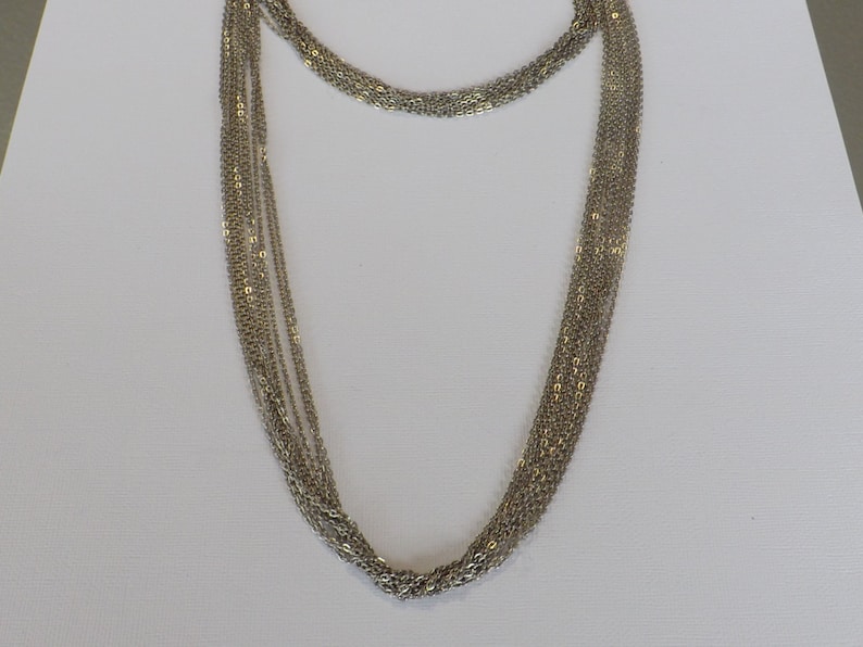Multi strand chain necklace made with 2 lengths