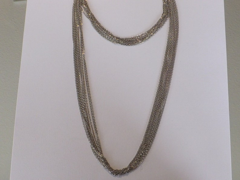 Multi strand chain necklace made with 2 lengths