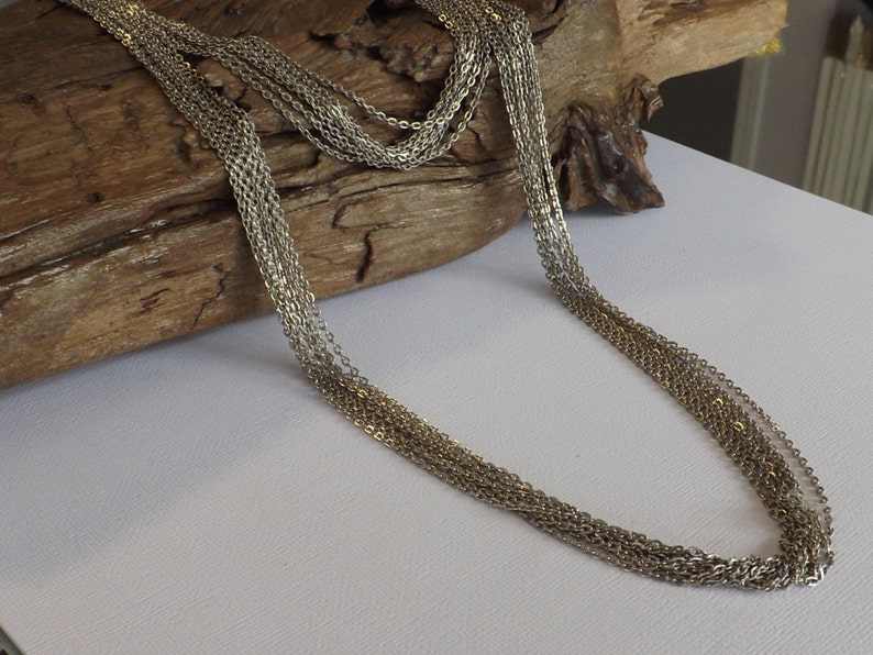 Multi strand chain necklace made with 2 lengths
