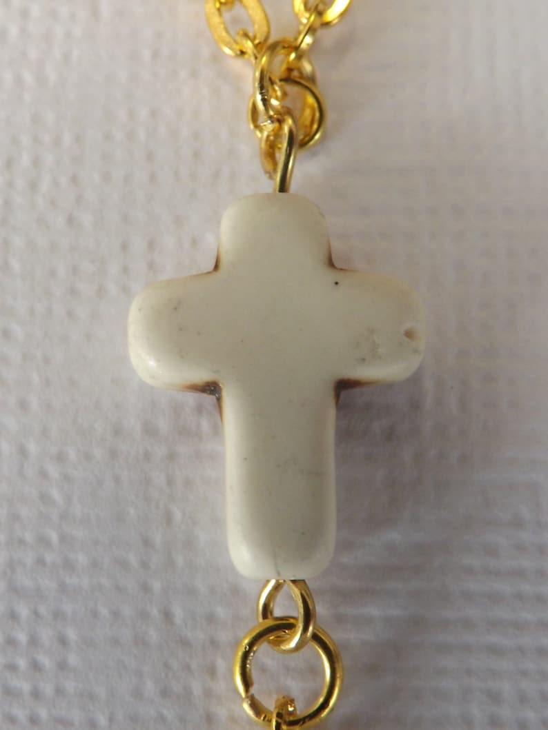 Ladies gold plated 2 strand Y style necklace with carved stone cross and gold plated heart