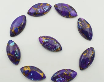 May include: Nine purple and gold oval-shaped cabochons with a marbled pattern.