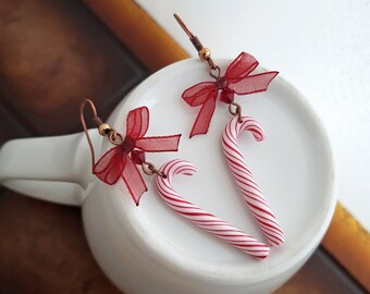 Christmas candy cane earrings, cute candy earrings handmade from polymer clay, peppermint cane earrings decorated with bow, Christmas candy