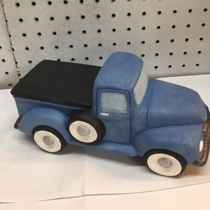 Handmade one of a kind ceramic truck with tonneau cover.