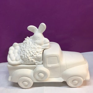 Hand poured ceramic bisque truck with Easter insert.