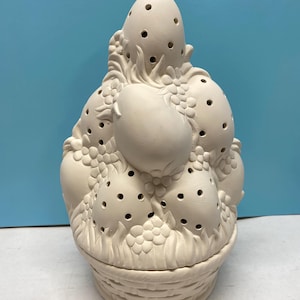 May include: A set of three ceramic mugs with a speckled, matte finish. The mugs are in shades of cream, light gray, and dark gray. Each mug has a simple, minimalist design, perfect for coffee or tea.