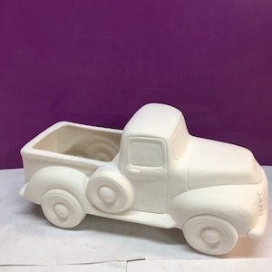 Hand poured bisque ceramic truck