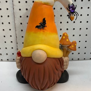 Handmade one of a kind ceramic candy corn gnome.