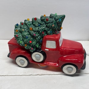 One of a kind handmade ceramic little red truck with lightable tree.