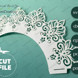 May include: White cupcake wrapper with a delicate, intricate, floral design. The wrapper is cut out to create a lacy effect. The image includes the text "Created with Love for You" and "DowiCreativity".