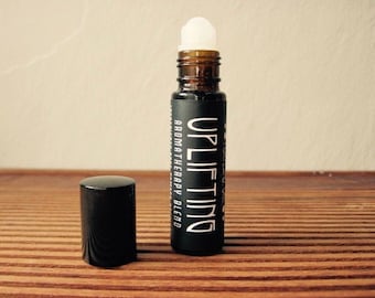 Uplifting -- Aromatherapy Roller -- 9 ml -- Lemon Eucalyptus. Lemongrass. Frankincense. Clove. Blood Orange. Rose.