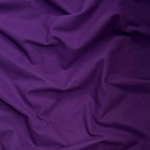 May include: A close-up shot of a piece of fabric in a deep purple hue. The fabric is soft and has many folds and wrinkles, creating shadows and variations in color. The texture of the material is visible.
