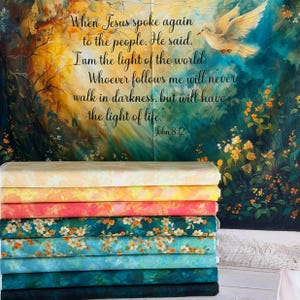 May include: A pile of patterned fabric rolls in shades of yellow, pink, and blue, with floral and abstract designs. The backdrop displays a painted scene with a dove and the text from John 8:12: "I am the light of the world."