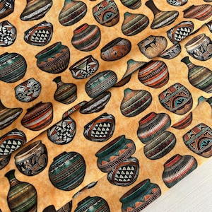 May include: A seamless fabric pattern featuring a repeating design of various Southwestern-style pottery in shades of brown, blue, green, and red on a light beige background.