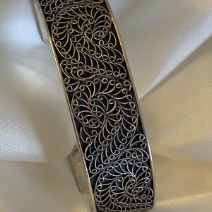 Vintage braod silver wrist bracelet band, intricately carved. From India