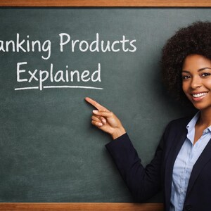 May include: A woman in a navy blazer and light blue shirt points to a chalkboard. The chalkboard has the words "Banking Products Explained" written in white chalk. The woman is smiling.