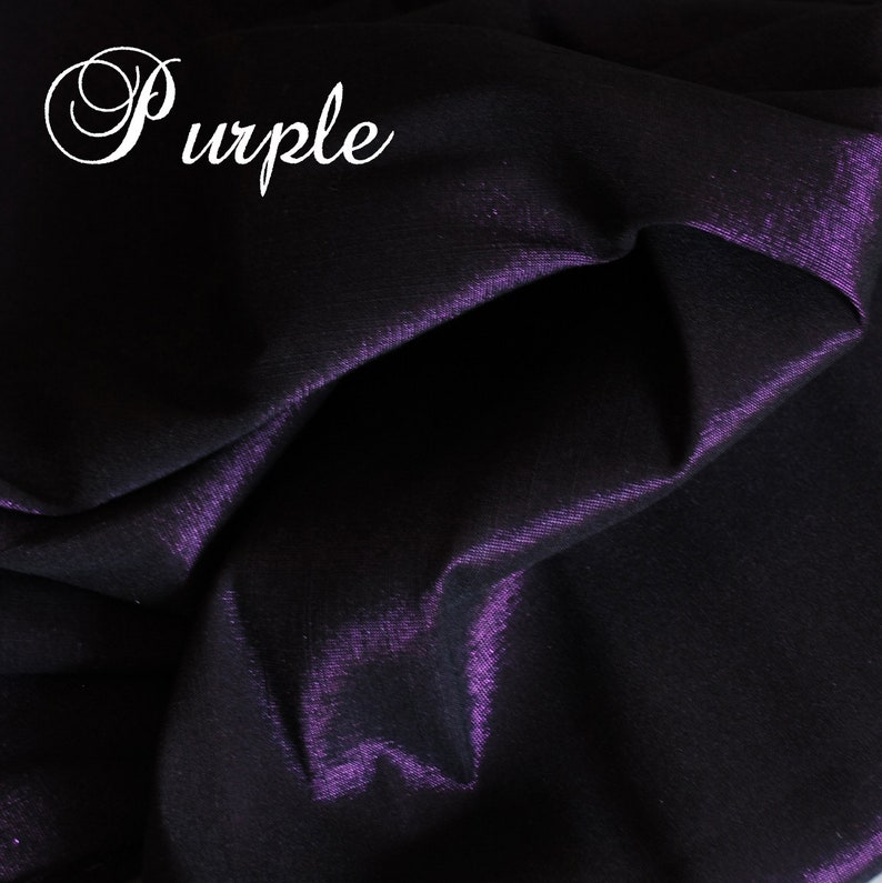 May include: Close-up of a deep purple fabric with a subtle sheen. The fabric is smooth and has a slight wrinkle.