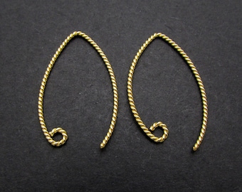 May include: A pair of gold-colored twisted wire earring hoops.