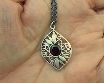 Garnet oval leaflike sterling silver pendant necklace