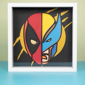 Caixa de Sombras 3D SVG Heroes • Modelo de Papel Recortado em Camadas Deadpool-Wolverine • Decoração de Parede com Silhueta Cricut