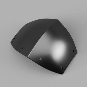 May include: A black metal armor piece with a curved shape and multiple small holes.