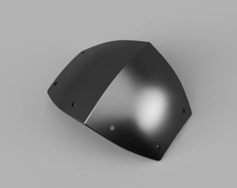 以下が含まれることがあります： 湾曲した形と複数の小さな穴のある黒い金属製の鎧の一部