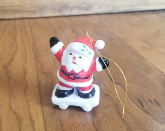 Vintage Miniature Santa on a skateboard ornament