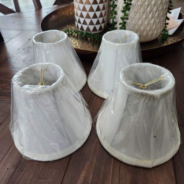 Four clip on lampshades...new old stock...never used....priced separately