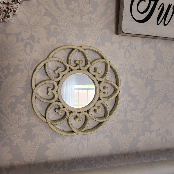 Round mirror with twists.....plastic....lightweight......distressed white