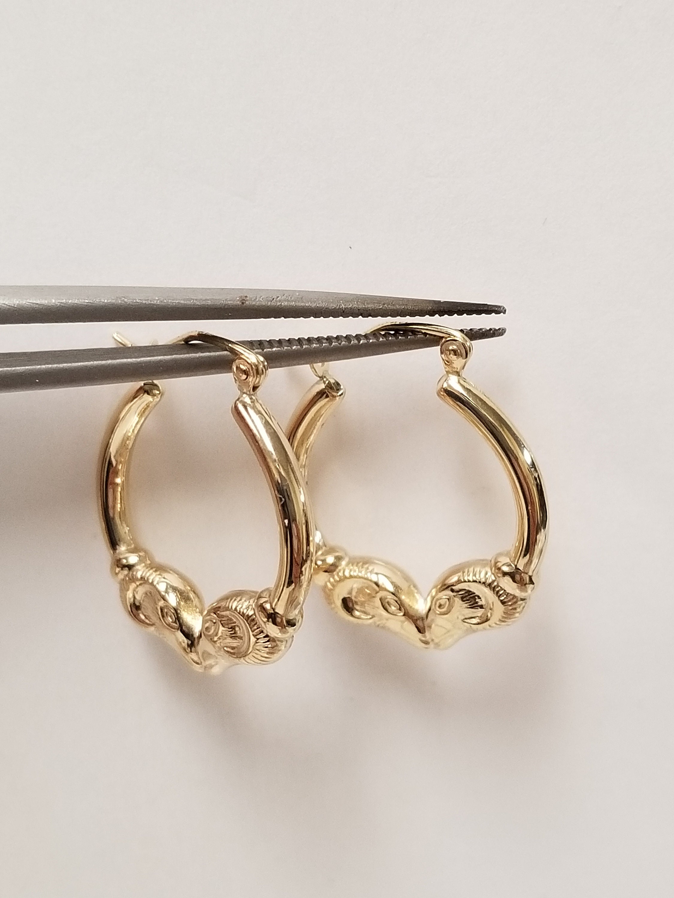 Gold ram shop head hoop earrings