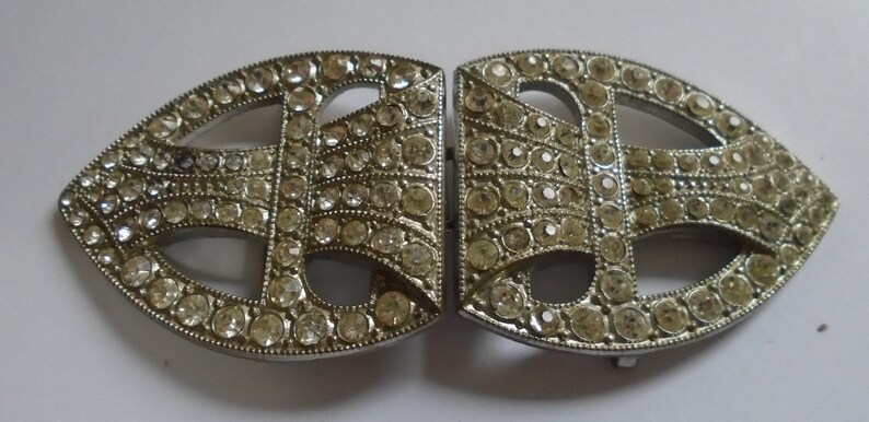 1 art deco buckle with white pastes set in chrome Back to back half tear drop shape 1920s 3 14 X 1 38 ref 9021