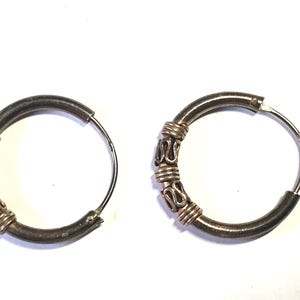 Vintage silver half hoop earrings with filigree bands along the design.   size 3/4" circle.  SJ614