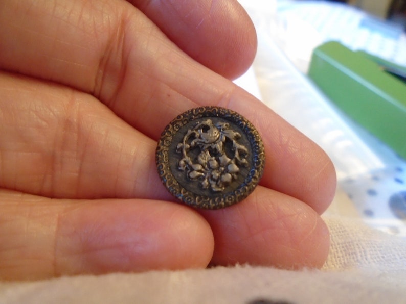 1890s 1116 or 17 mm dia Ref 7418 Lovely 1 brass and cut steel cup button with bird in a bush Austrian tiny Metal back